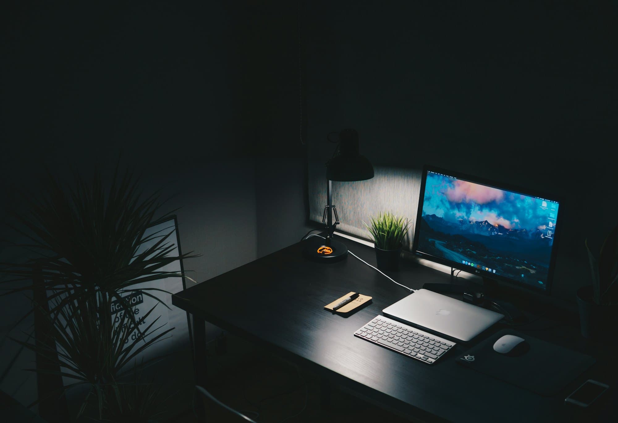 A calm, dark studio desk